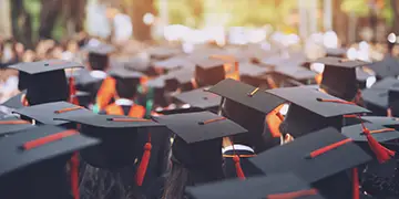 Diverse college-bound students graduating high school