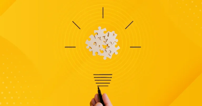 A light bulb over a yellow background represents putting puzzle pieces together to inspire student learning.