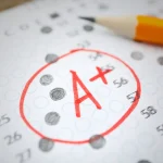 A+ AP Exam Score Sheet with pencil on it