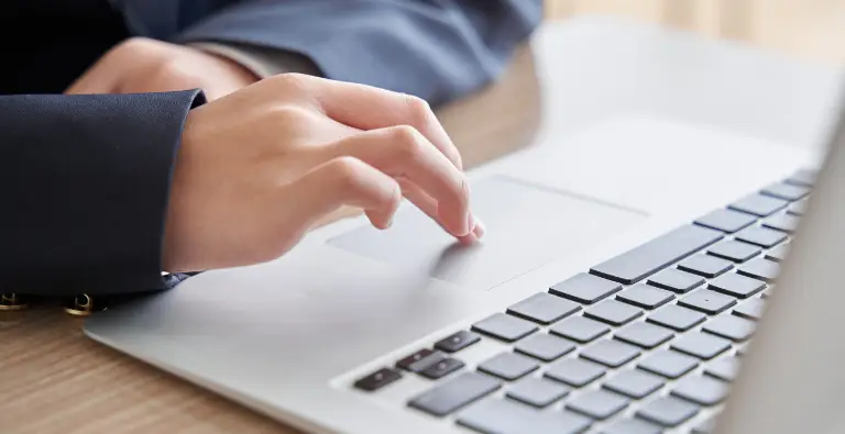 A teacher using laptop for the best resource for AP Teachers