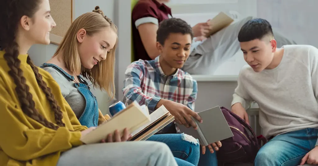 Group of multicultural high school teenage high school students doing AP homework together