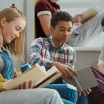 Group of multicultural high school teenage high school students doing AP homework together